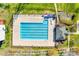 Aerial view of a community swimming pool with a bathhouse, lounge chairs, and manicured landscaping at 1835 Montague Rd, Clover, SC 29710