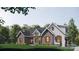 Charming home with mixed brick and board and batten siding, complemented by neat landscaping and shuttered windows at 1905-A Bechtler Rd, Edgemoor, SC 29712