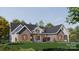Beautiful single-story home with a brick and siding facade, black roof, and a well-manicured lawn at 1905-A Bechtler Rd, Edgemoor, SC 29712