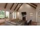 Inviting living room with vaulted ceilings, a fireplace, and French doors leading to the backyard at 1905-A Bechtler Rd, Edgemoor, SC 29712