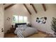 A serene bedroom features a large window for natural light, complemented by stylish decor and neutral tones at 1905-A Bechtler Rd, Edgemoor, SC 29712