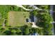 Aerial view showcasing a home, outbuilding, fire pit, and spacious yard surrounded by mature trees at 1920 Williford Woods Ln # 5, Rock Hill, SC 29730