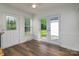 Bright breakfast nook with white walls, french doors leading to the back, and attractive floors at 1920 Williford Woods Ln # 5, Rock Hill, SC 29730