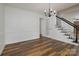 Bright dining room featuring hardwood floors, wainscoting, and a chandelier at 1920 Williford Woods Ln # 5, Rock Hill, SC 29730
