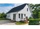 Charming white home with a dark roof, complemented by a neatly paved patio and lush landscaping at 1920 Williford Woods Ln # 5, Rock Hill, SC 29730
