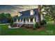 Charming two-story home with a welcoming front porch and beautifully landscaped front yard at 1920 Williford Woods Ln # 5, Rock Hill, SC 29730