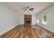 Bright living room with hardwood floors, brick fireplace, and large windows at 1920 Williford Woods Ln # 5, Rock Hill, SC 29730