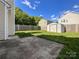 Spacious backyard with a concrete patio and a wooden fence at 2713 Reid Meadows Dr, Charlotte, NC 28208