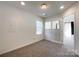 Bright bedroom with neutral carpet, white walls, and natural light at 2713 Reid Meadows Dr, Charlotte, NC 28208