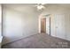 Bedroom featuring neutral carpet, a ceiling fan, and a window at 2713 Reid Meadows Dr, Charlotte, NC 28208