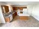 A full kitchen featuring an island, matching cabinetry, white appliances and decorative backsplash at 2713 Reid Meadows Dr, Charlotte, NC 28208