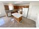 A full kitchen featuring an island, matching cabinetry, white appliances and decorative backsplash at 2713 Reid Meadows Dr, Charlotte, NC 28208
