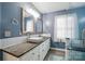 En-suite bath with double sink vanity and walk-in glass shower at 305 Phillip Dr, Salisbury, NC 28146