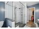 Modern bathroom featuring a glass shower with tiled accents and a walk-in closet at 305 Phillip Dr, Salisbury, NC 28146