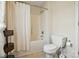A clean bathroom with white toilet and shower/tub featuring a white curtain at 305 Phillip Dr, Salisbury, NC 28146