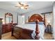 Primary suite features a four poster bed, wooden furniture, and carpet flooring at 305 Phillip Dr, Salisbury, NC 28146