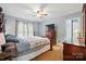 Primary bedroom suite features a wooden bed frame and neutral colored walls at 305 Phillip Dr, Salisbury, NC 28146