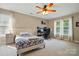 Bright bedroom with lots of natural light with a ceiling fan and dedicated desk/work space at 305 Phillip Dr, Salisbury, NC 28146