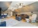 Spacious bonus room featuring vaulted ceilings, neutral paint, ceiling fans, and comfortable seating arrangements at 305 Phillip Dr, Salisbury, NC 28146