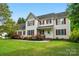 Charming two-story home featuring red shutters and a beautifully landscaped front yard at 305 Phillip Dr, Salisbury, NC 28146