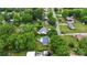 An aerial shot shows a residential neighborhood with lush greenery and well-maintained homes at 324 Autumn Dr, Harrisburg, NC 28075