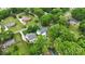 Aerial view showcasing the home's location within a mature, tree-lined neighborhood at 324 Autumn Dr, Harrisburg, NC 28075