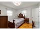 Cozy bedroom features a bed, hardwood floors, and natural light from the window at 324 Autumn Dr, Harrisburg, NC 28075