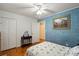Comfortable bedroom with textured blue accent wall and stylish decor throughout the room at 324 Autumn Dr, Harrisburg, NC 28075