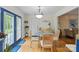 Bright dining area features hardwood floors and French doors at 324 Autumn Dr, Harrisburg, NC 28075