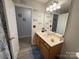 Bathroom featuring a vanity with sink, mirror, and stylish wood look flooring at 3300 Luke Ct, Monroe, NC 28112