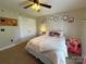 Bedroom with carpet, decorated with hearts and featuring a bed with a white blanket and stuffed animals at 3300 Luke Ct, Monroe, NC 28112