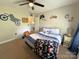 Bedroom with gaming theme, features a ceiling fan and comfortable furnishings at 3300 Luke Ct, Monroe, NC 28112