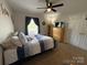 This bedroom features a ceiling fan and plenty of storage at 3300 Luke Ct, Monroe, NC 28112