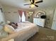 Bright bedroom featuring a bed, dresser, and carpeted flooring at 3300 Luke Ct, Monroe, NC 28112