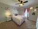 Cozy bedroom featuring a plush bed, neutral tones, and stylish decor at 3300 Luke Ct, Monroe, NC 28112