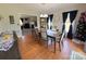 Inviting dining room with hardwood floors, dark wood table, and decorative Christmas tree at 3300 Luke Ct, Monroe, NC 28112