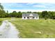 Spacious property featuring a well-maintained lawn and charming single-story house at 3300 Luke Ct, Monroe, NC 28112