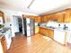 Spacious kitchen featuring wooden cabinets, a stainless steel fridge, and vinyl floors at 3300 Luke Ct, Monroe, NC 28112