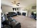 Inviting living room featuring a cozy fireplace, plush furniture, and ample space at 3300 Luke Ct, Monroe, NC 28112