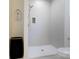 Modern walk-in shower with white tiling and a rainfall shower head at 3300 Travis Nw Ln, Concord, NC 28027