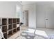 Sunny bedroom with cloud rug, cube shelving, and natural light from the window at 3300 Travis Nw Ln, Concord, NC 28027