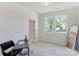 Bright bedroom with two windows, light wood floors, and an adjacent doorway at 3300 Travis Nw Ln, Concord, NC 28027