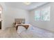 Bright bedroom with neutral decor, featuring two windows offering ample natural light at 3300 Travis Nw Ln, Concord, NC 28027