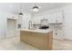 Modern kitchen boasts a large island, white cabinetry, and stainless steel appliances at 3300 Travis Nw Ln, Concord, NC 28027