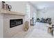 Bright, open-concept living room with modern fireplace and light wood flooring at 3300 Travis Nw Ln, Concord, NC 28027
