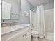 Bright bathroom featuring a white vanity with marble countertop, and a shower/tub combination at 3610 Mill Pond Rd, Charlotte, NC 28226
