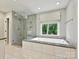 Modern bathroom with a glass-enclosed shower, soaking tub, and a large window at 3610 Mill Pond Rd, Charlotte, NC 28226