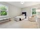 Cozy bedroom featuring natural light and a sitting area at 3610 Mill Pond Rd, Charlotte, NC 28226