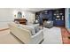 Comfortable living room with a fireplace, blue shelving, and natural light at 3610 Mill Pond Rd, Charlotte, NC 28226