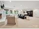 Bright living room with a fireplace, chairs, and a sofa at 3610 Mill Pond Rd, Charlotte, NC 28226